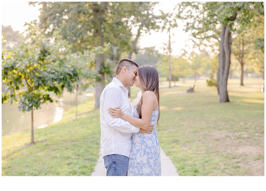 engaged couple smiling for engagement photos