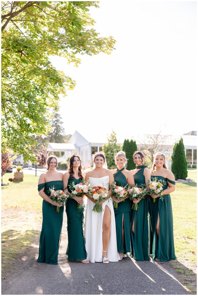 Emerald bridesmaid dresses paired with ivory florals at a South Jersey fall wedding