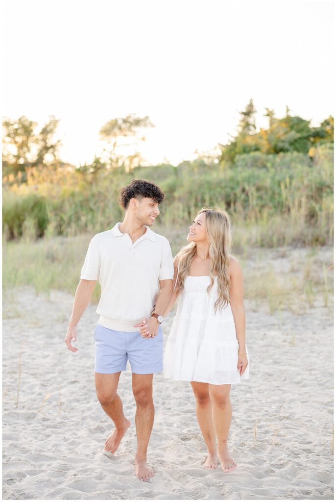 Engaged couple photographed at Fisherman’s Cove in Manasquan, NJ with ocean views